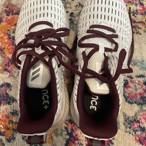 Maroon and white adidas bounce